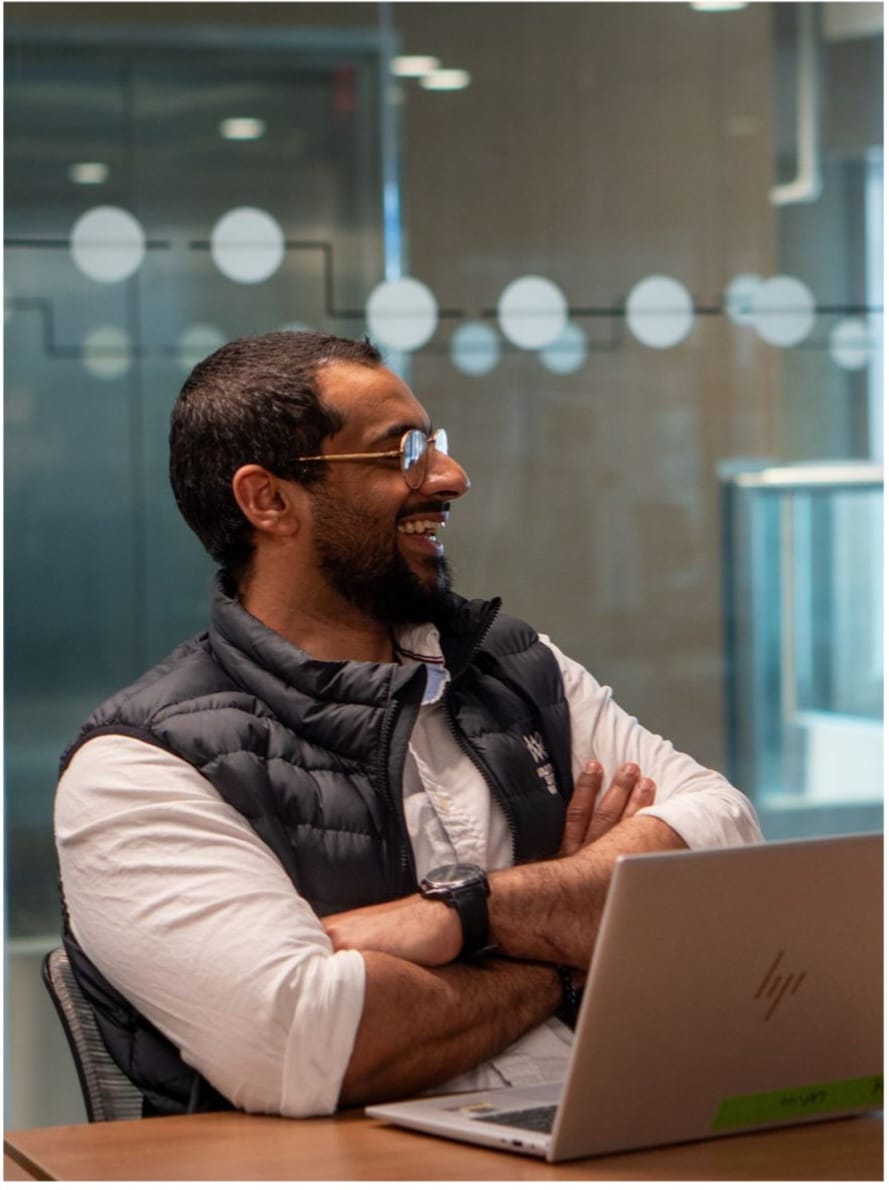 Luthfy working in a collaborative office setting